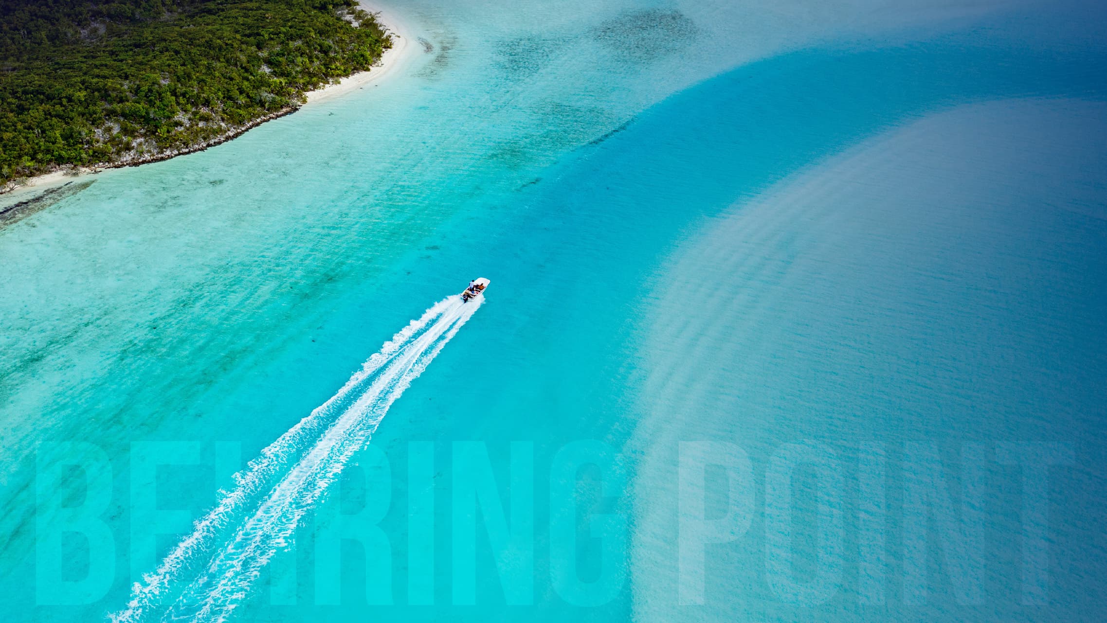 An angler casting a fly line from the bow of a skiff on the Andros Island flats at golden hour