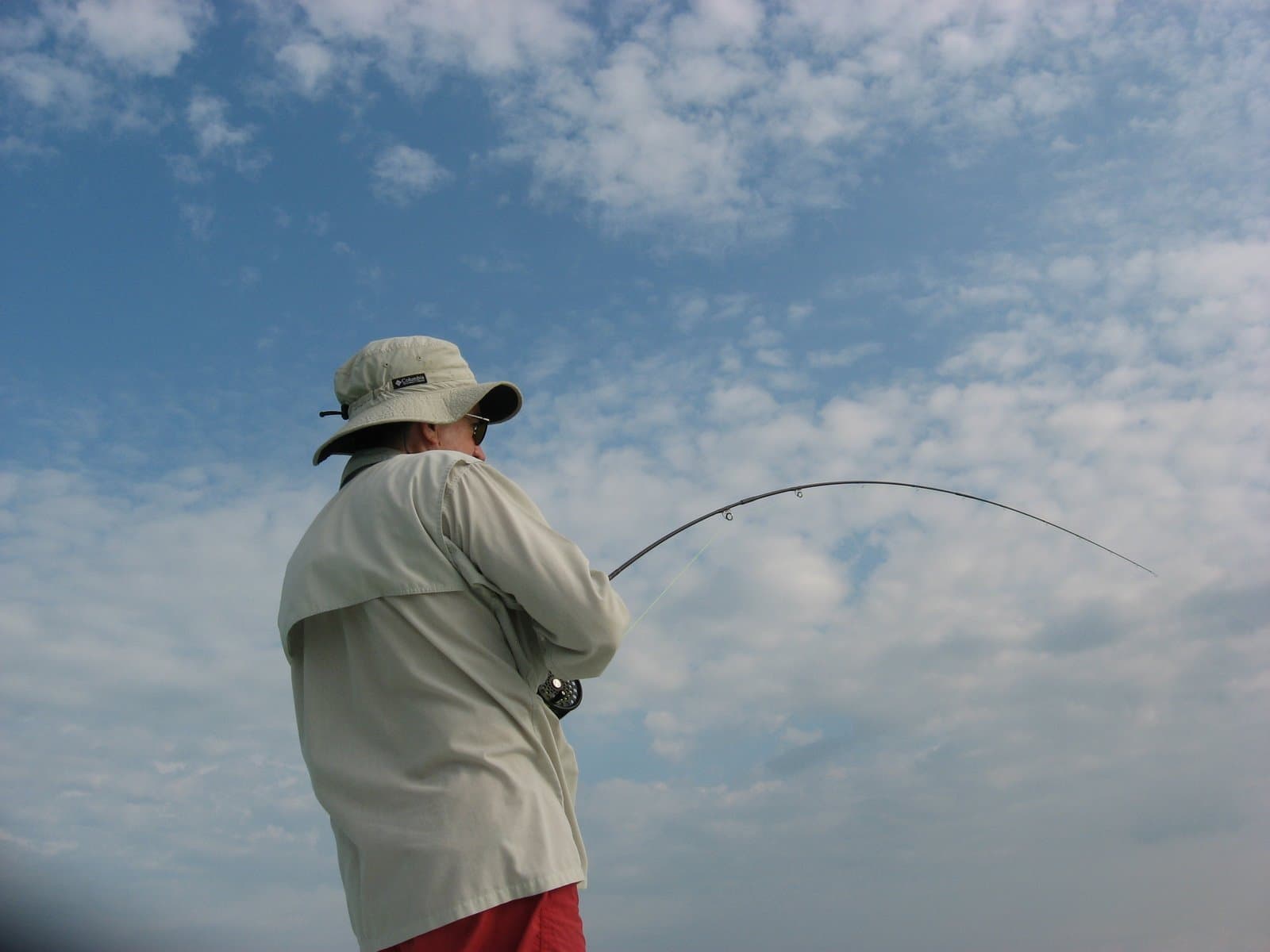 Two anglers with a double on the skiff