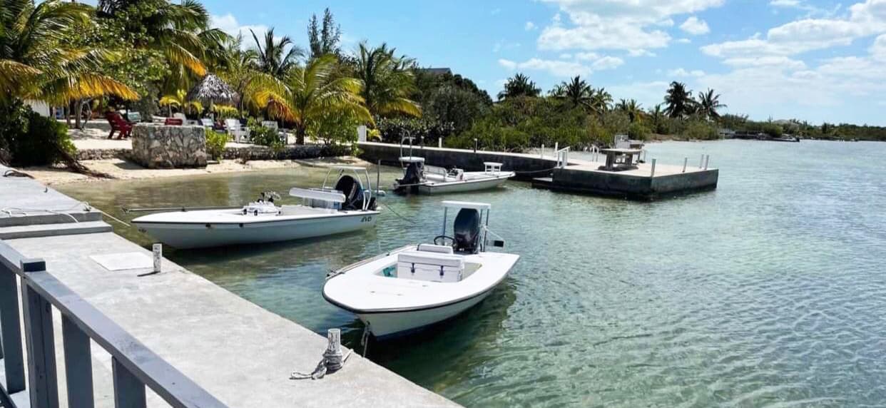 Fishing skiffs moored along the canal at Behring Point, steps from the Inn