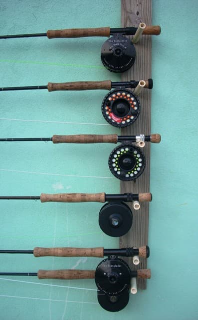 Guests' fly rods and reels racked at the Inn, ready for the morning tide
